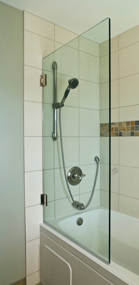 Closed swing glass wall replaces need for shower door or curtain in this North Vancouver bathroom