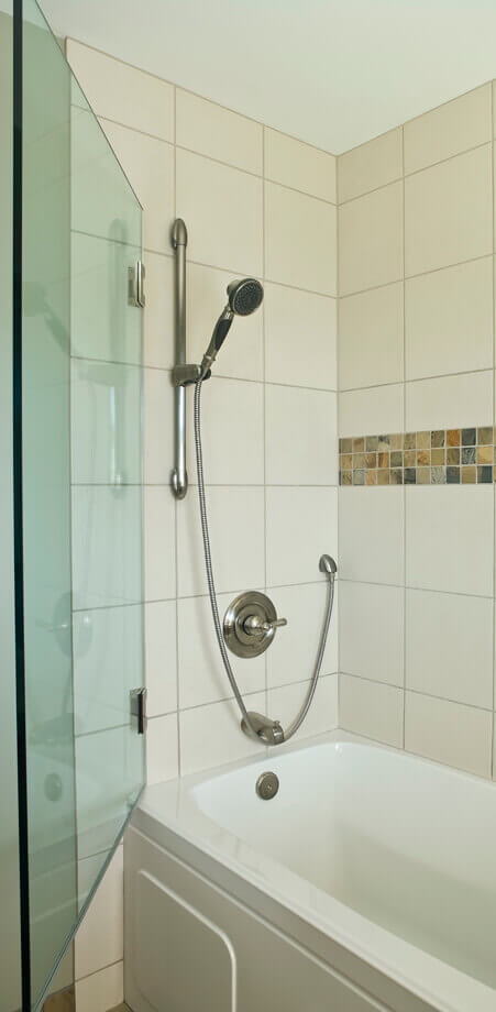 Open swing glass wall replaces need for shower door or curtain in this North Vancouver bathroom