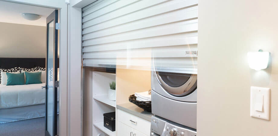 Burnaby lynndale renovation laundry room roll-up garage style door opening