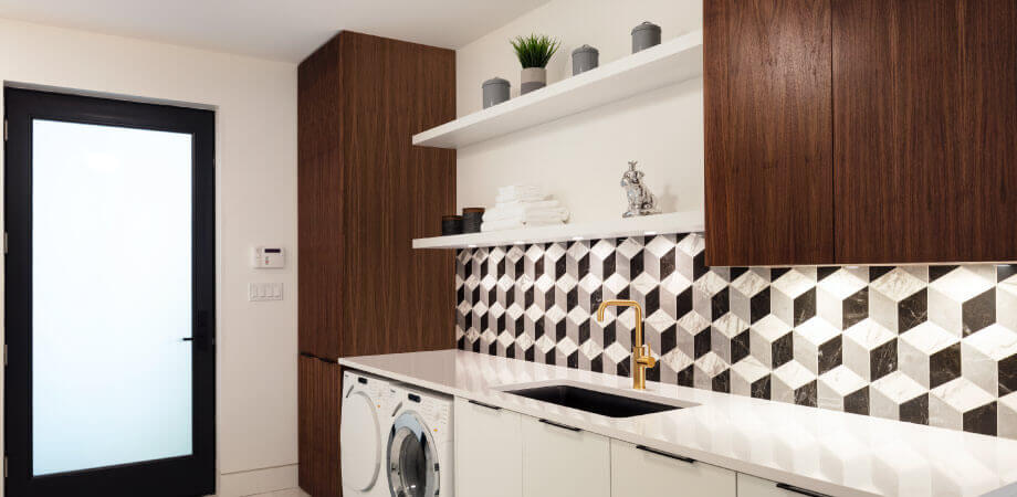 Laundry Room with Unique Backsplash by TQ Construction