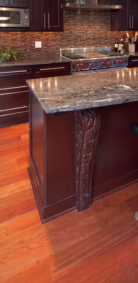 custom cherry wood kitchen features wine motif carved millwork