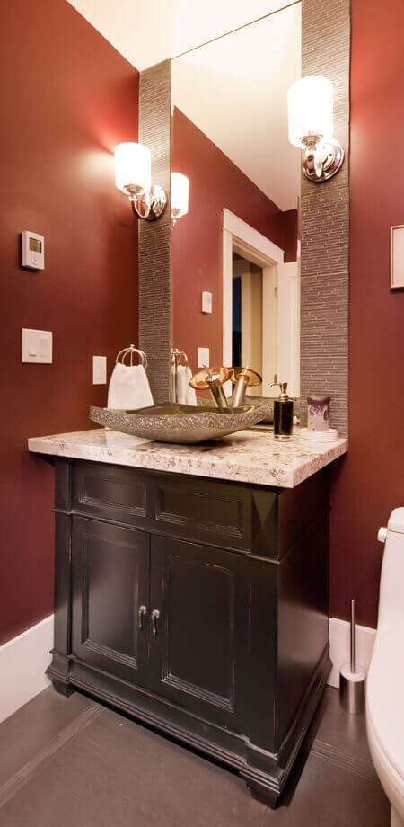 matchstick tiles frame mirror of this masculine traditional powder room