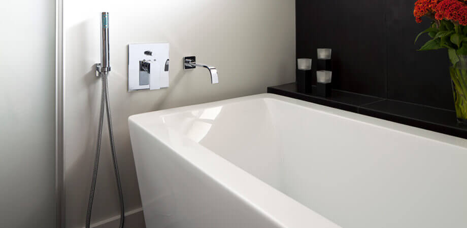 North Vancouver Bathroom Renovation Shows Bathtub with Modern Square Plumbing Fixtures