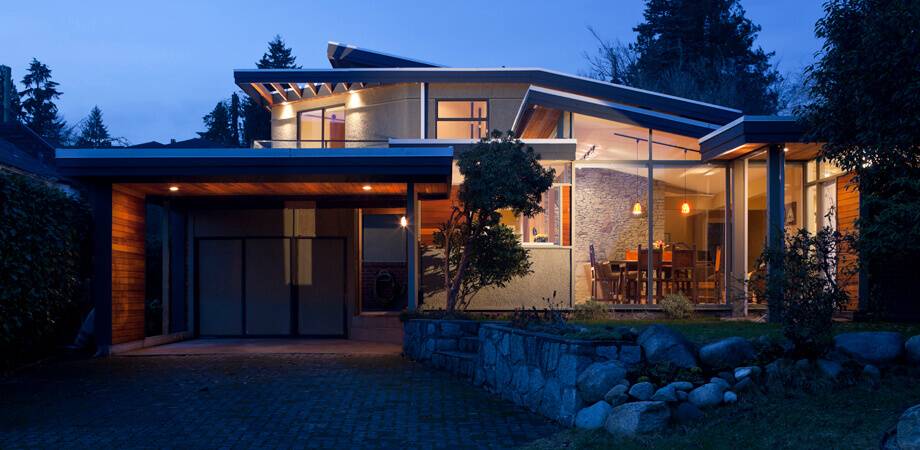 front exterior curb appeal dusk shot award winning architectural addition north Vancouver bungalow