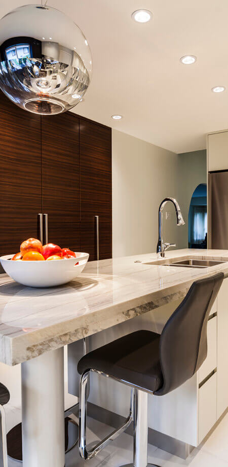 spacious seating and eye catching light fixture at large functional kitchen island north vancouver