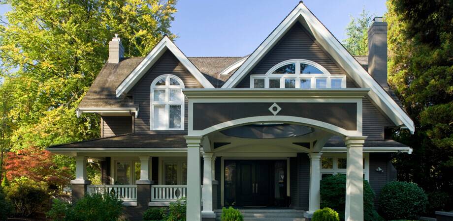 exterior front facade and porte-cochere of traditional craft style vancouver home