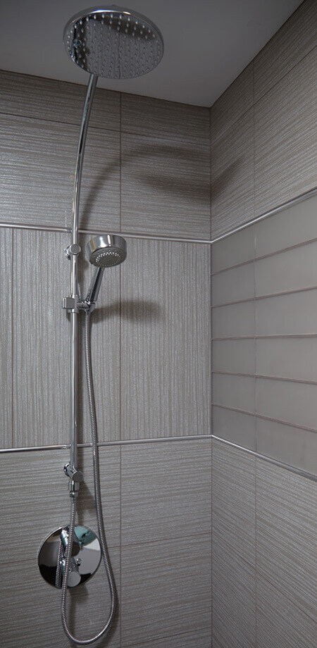 vancouver special whole house renovation modern bathroom dual shower head detail