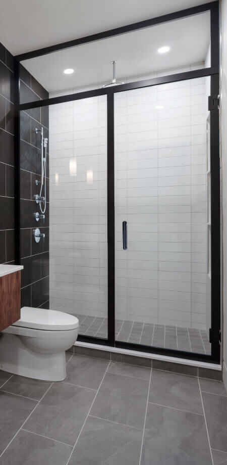 Industrial Black Grid Walk In Shower by TQ Construction