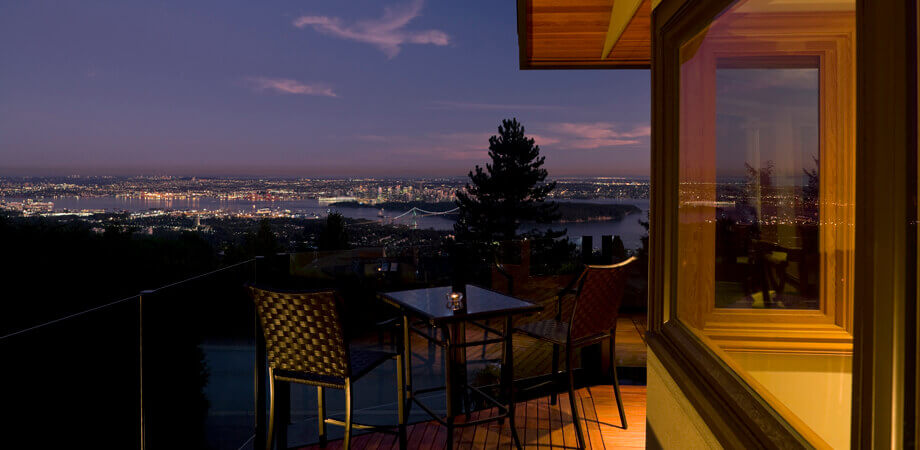 patio views enjoyed day and night from this renovated west Vancouver home